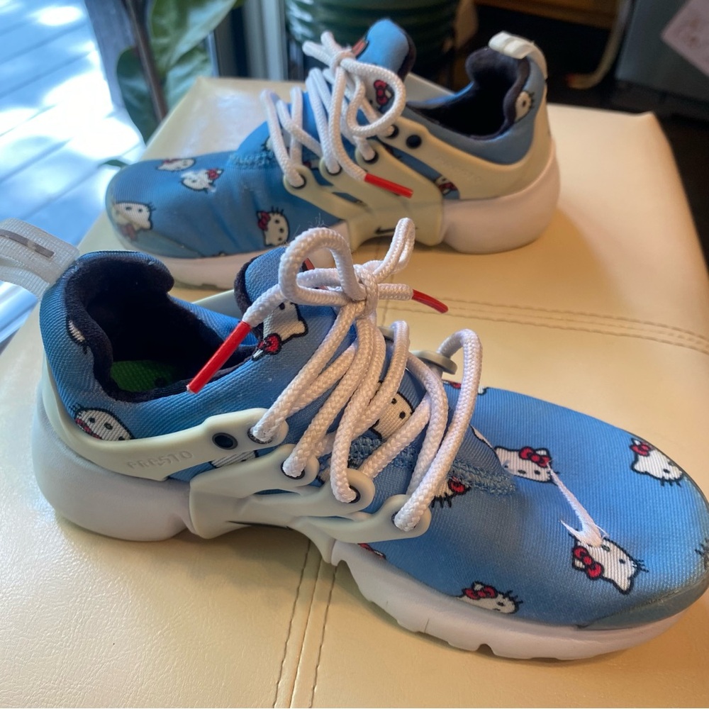 Nike Blue Sneakers with White Laces and Sporty Design